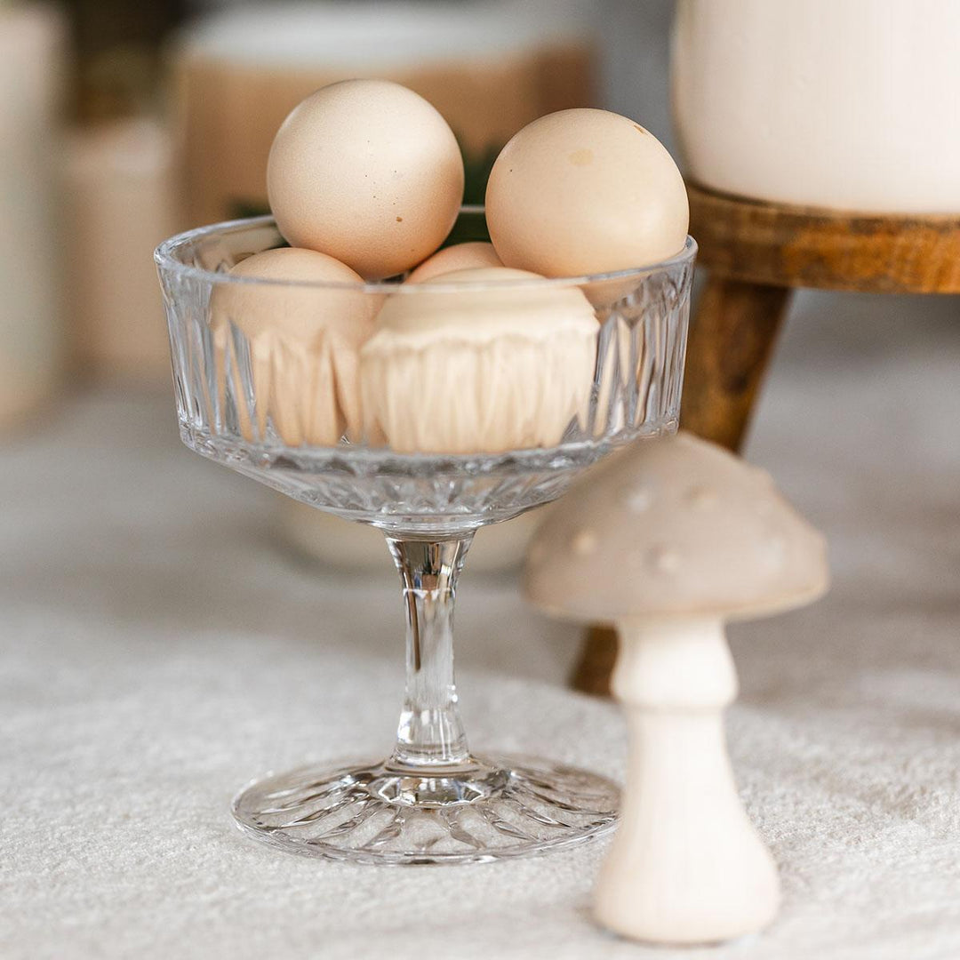 Yellow Phalaenopsis orchid in a yellow Simplicity pot on a bamboo plate, part of Everspring's Kolibri Orchids gift set.